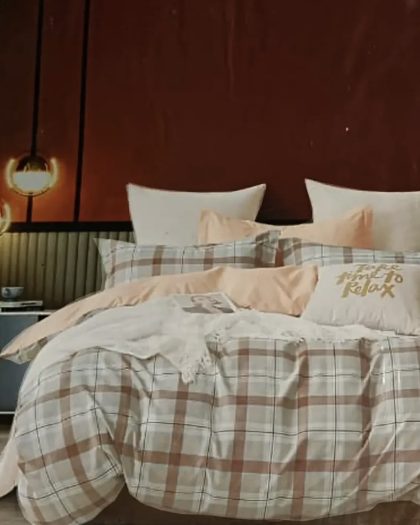 Elegant brown and white checkered bedsheet set with matching pillows in a modern bedroom.