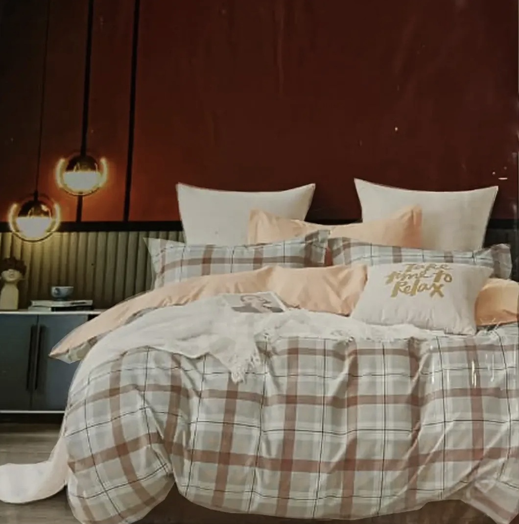 Elegant brown and white checkered bedsheet set with matching pillows in a modern bedroom.