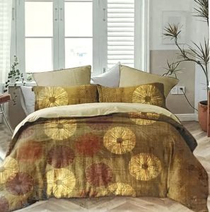 Elegant golden and brown bedspread with artistic circular floral patterns and matching decorative cushions