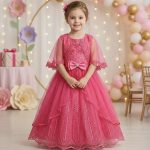 Pink lace embroidered party gown for girls with cape sleeves, bow belt and layered tulle skirt
