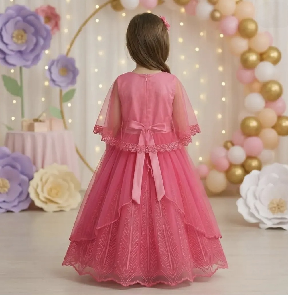 Back view of pink lace party gown for girls with cape sleeves, satin bow tie and layered tulle skirt