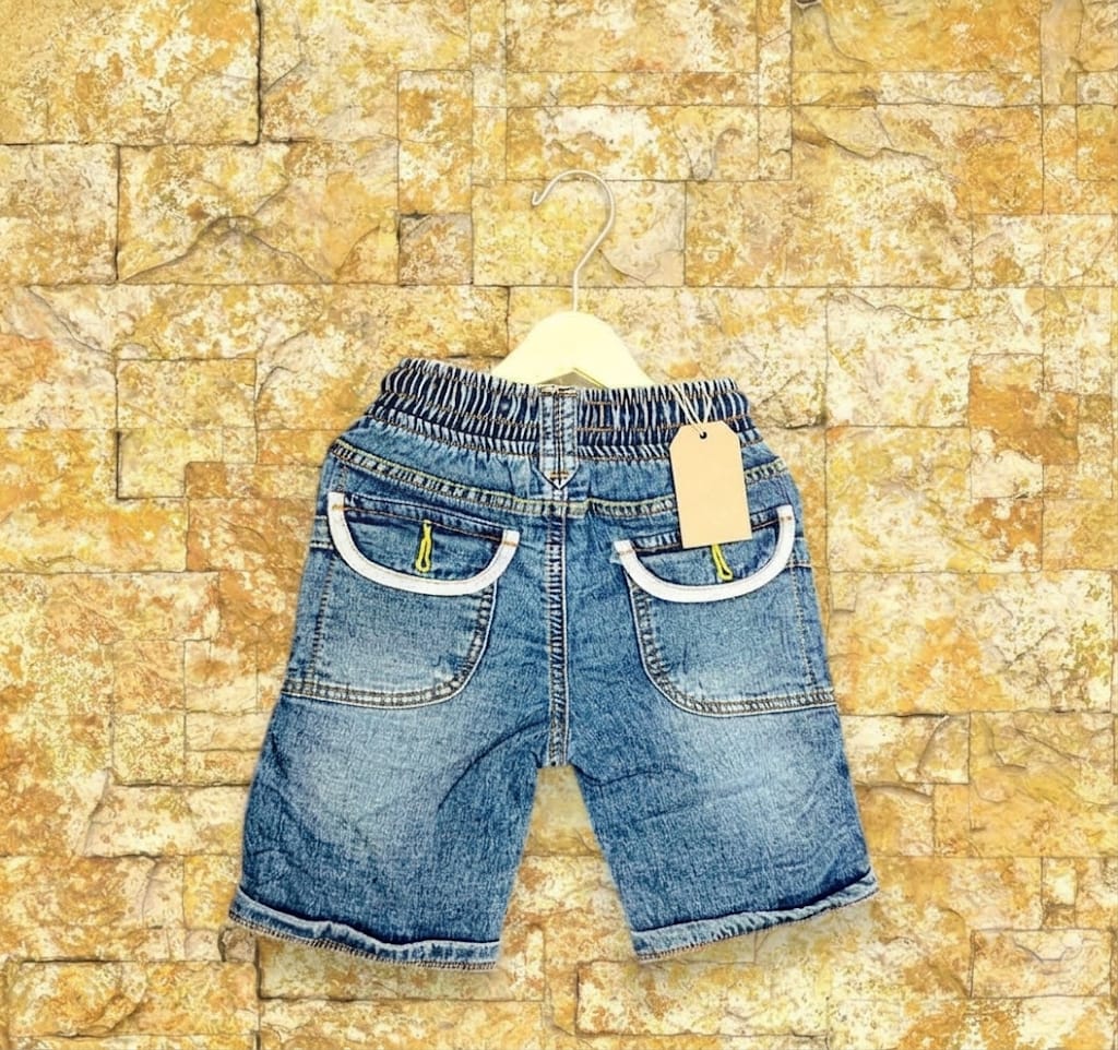Blue denim shorts for boys with elastic waistband and decorative front pockets