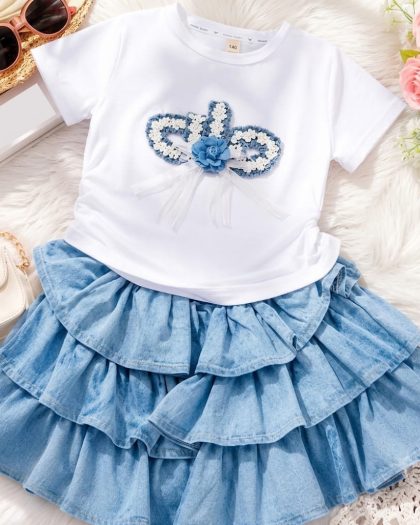 Girls white t-shirt with floral butterfly embellishment and layered blue denim skirt