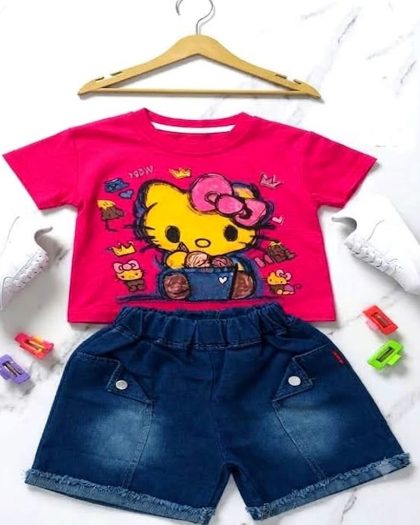 Girls pink graphic t-shirt with character print and dark blue denim shorts